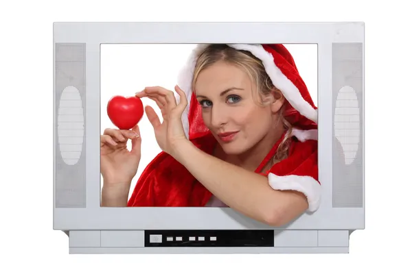 Woman wearing a Christmas costume behind a TV screen — Stock Photo, Image
