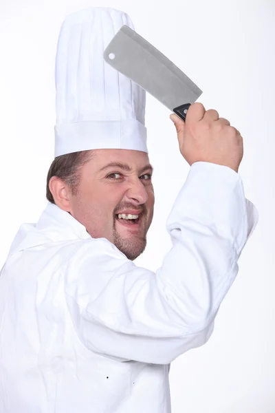 白人挥舞着一把菜刀的厨师 — 图库照片