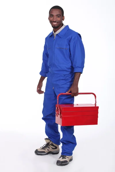 Kırmızı araç kutusu ile işçi — Stok fotoğraf