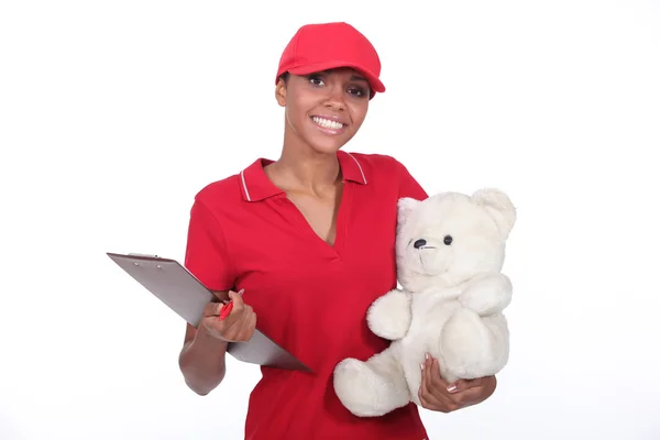 Delivery woman smiling on white background — Stock Photo, Image