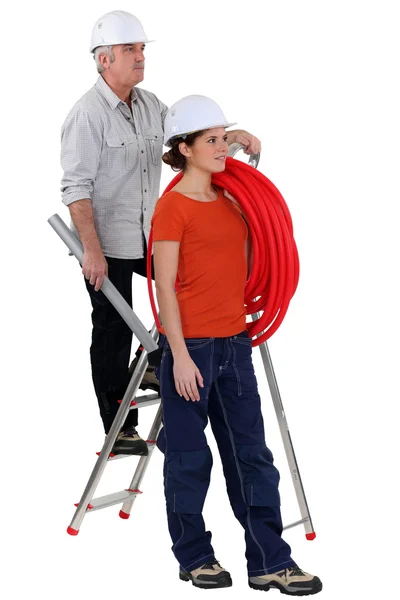 Electrician and female trainee — Stock Photo, Image