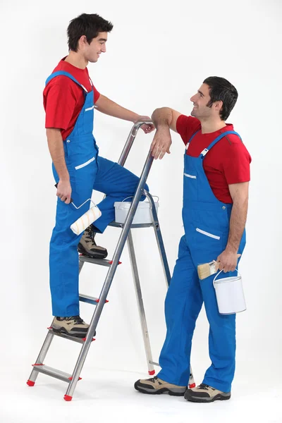 Twee decorateurs in uniform — Stockfoto