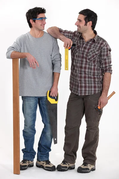 Carpenter and his apprentice — Stock Photo, Image