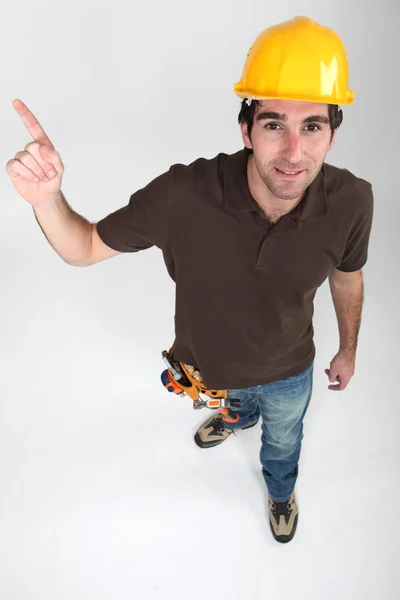 Builder pointing at copyspace — Stock Photo, Image