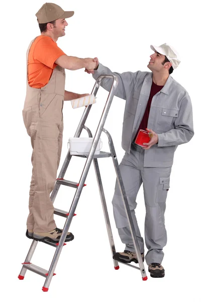 stock image Decorators shaking hands