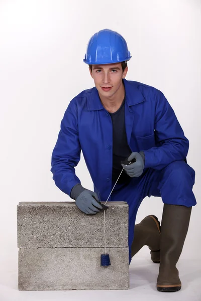 Bricklayer in blue overalls — Stock Photo, Image