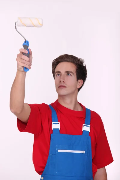 Man using paint roller — Stock Photo, Image