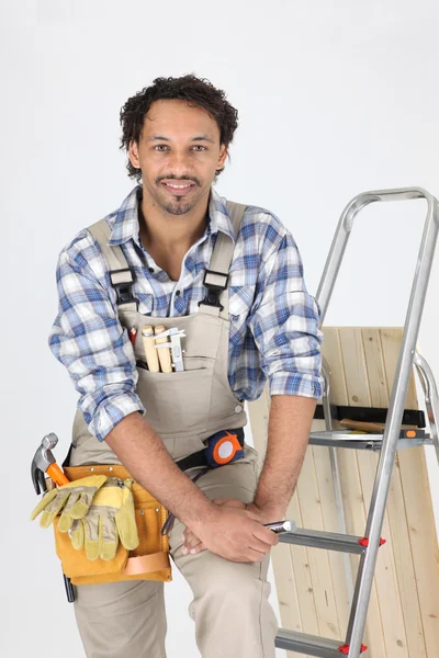 Carpenter stood by step-ladder — Stock Photo, Image
