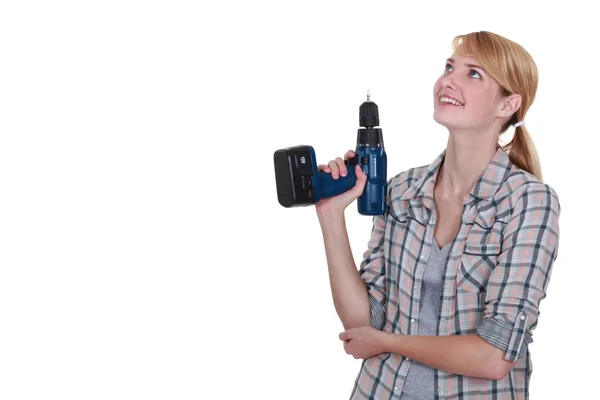 Craftswoman holding a drill — Stock Photo, Image