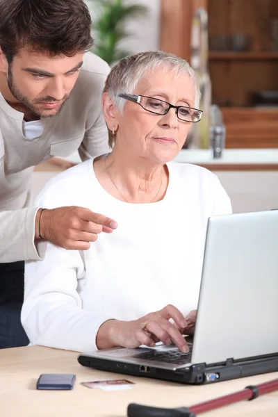 Portrait of a young man and older woman — Stock Photo, Image