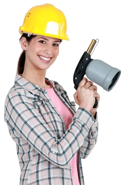 Woman holding blow-torch Royalty Free Stock Images