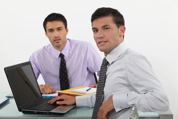 Two male office workers Stock Photo