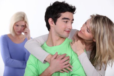 Couple in love and jealous woman in background clipart