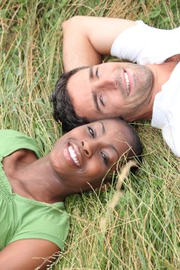 Man lying in grass clipart