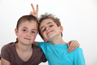 Portrait of schoolgirl posing with classmate clipart