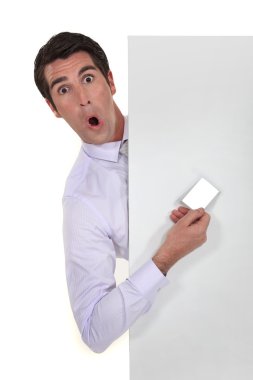 Man hiding showing business card playing the fool clipart