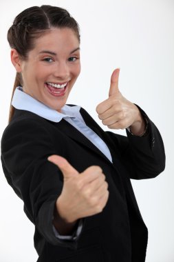 Businesswoman giving two thumb's up clipart