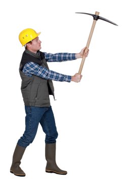 Man wielding pick-axe clipart