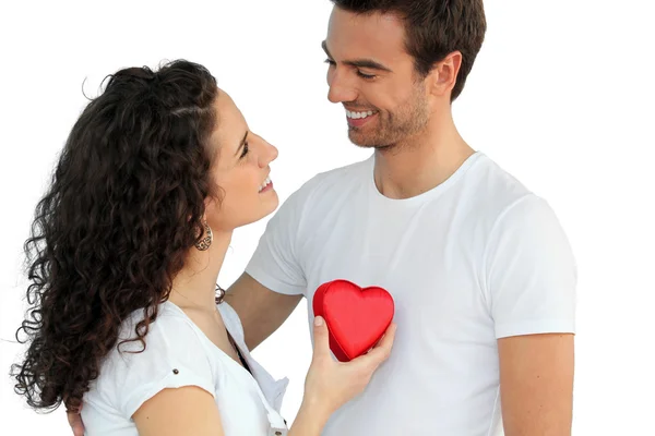 Woman giving man her heart — Stock Photo, Image
