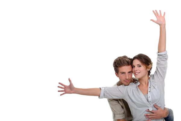 stock image Girl with open arms and boyfriend embracing her