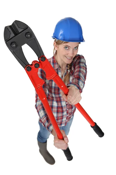Glückliche Bauarbeiterin mit Bolzenschneider — Stockfoto