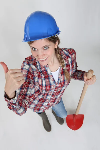 Young female bricklayer holding shovel — Stock Photo, Image
