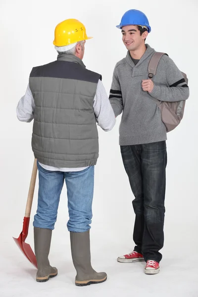 Experienced tradesman meeting his new apprentice for the first time — Stock Photo, Image