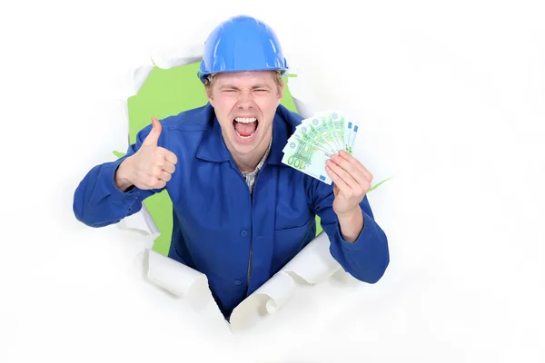 A male construction worker with plenty of cash. — Stock Photo, Image