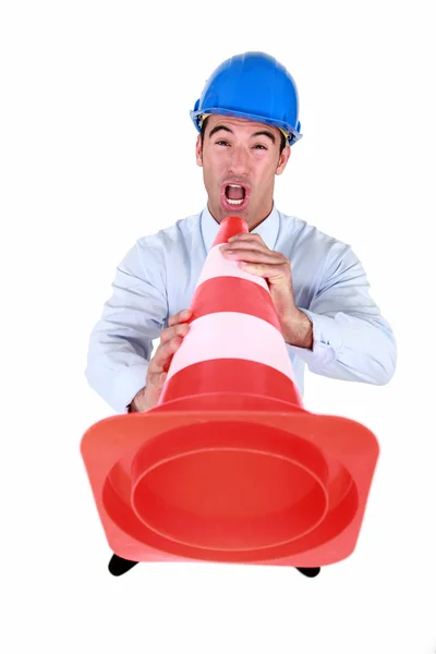 Man shouting into traffic cone — Stock Photo, Image