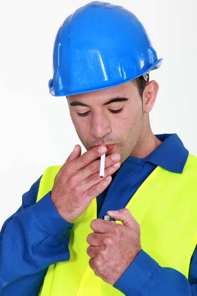 Stock image Handyman about to light a smoke.