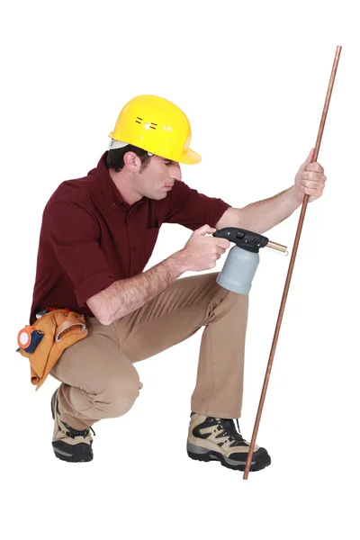 Tradesman using a blowtorch — Stock Photo, Image