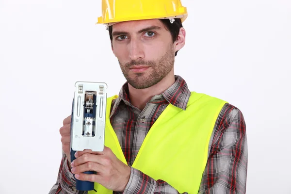A manual worker with a jigsaw. — Stock Photo, Image