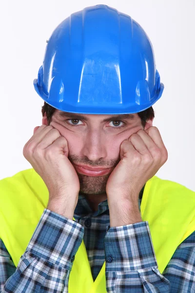 A grumpy and frustrated tradesman — Stock Photo, Image