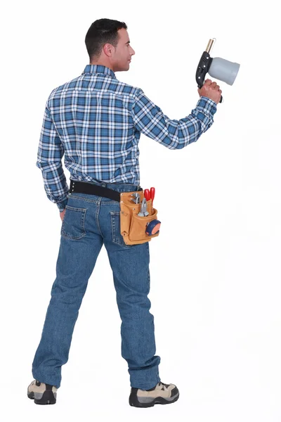 Um trabalhador da construção masculino segurando uma tocha de solda . — Fotografia de Stock