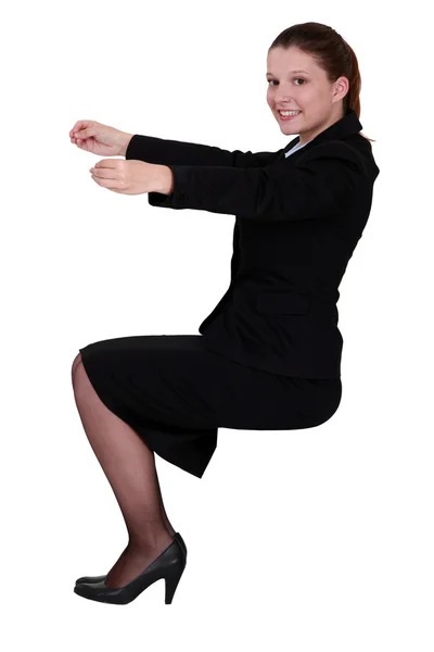 Businesswoman holding an invisible object — Stock Photo, Image