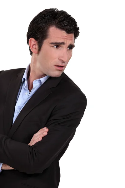 Businessman with his arms folded in disbelief — Stock Photo, Image