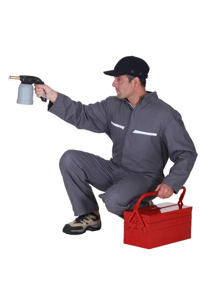 Workman with a blowtorch — Stock Photo, Image