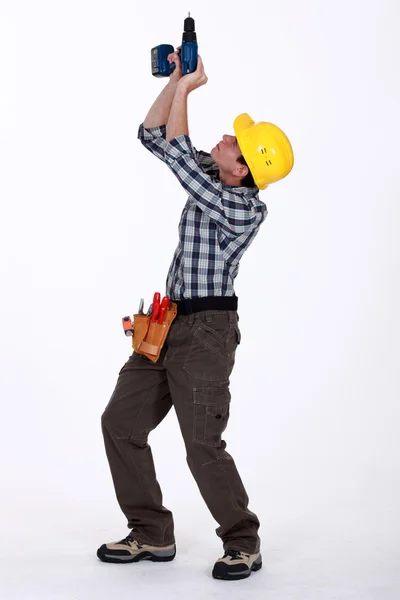 Tradesman piercing il soffitto — Foto Stock