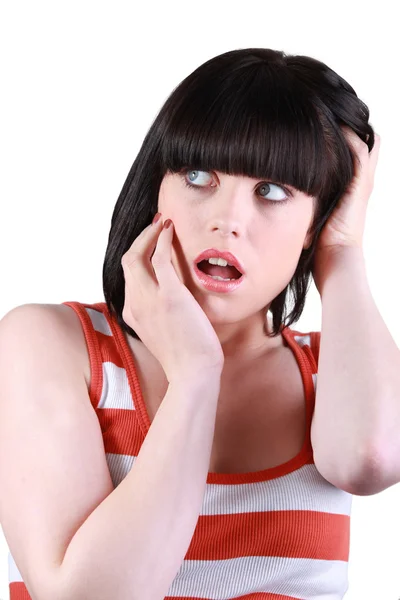 Shocked brunette touching face — Stock Photo, Image