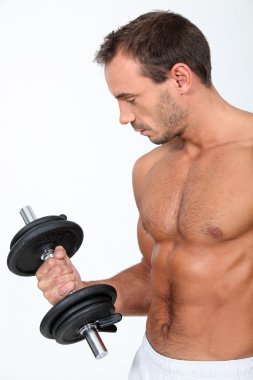 Muscular man lifting a dumbbell clipart