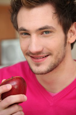 Young man with a red apple clipart