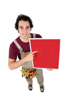 Handyman pointing to a red sign clipart