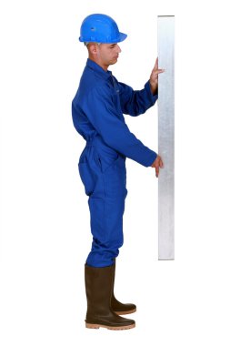 Craftsman holding a metal board clipart