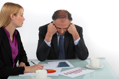 Director and employee in a meeting clipart