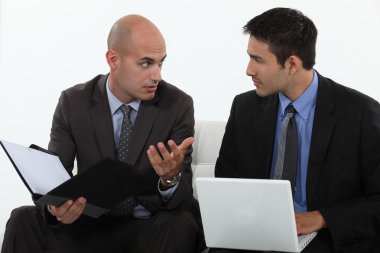 Men discussing a business proposition clipart