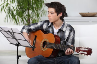 A young guitarist. clipart