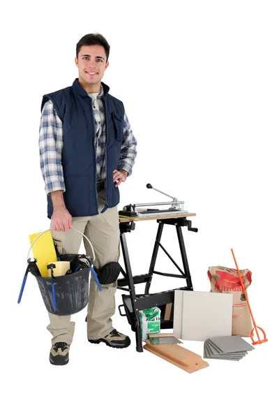 Tile cutter surrounded by supplies — Stock Photo, Image