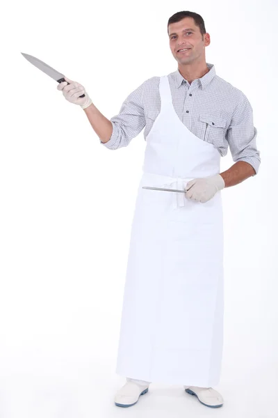 Carniceiro segurando faca — Fotografia de Stock
