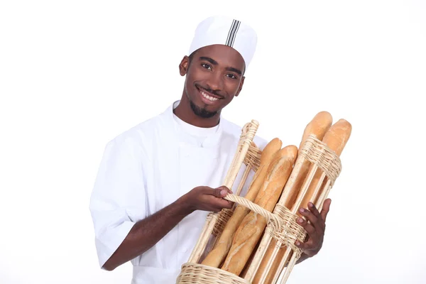Jeune homme boulanger souriant — Photo
