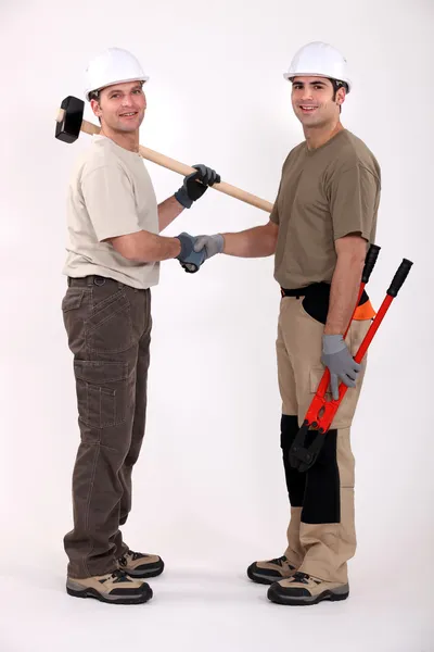 Craftsmen shaking hands — Stock Photo, Image